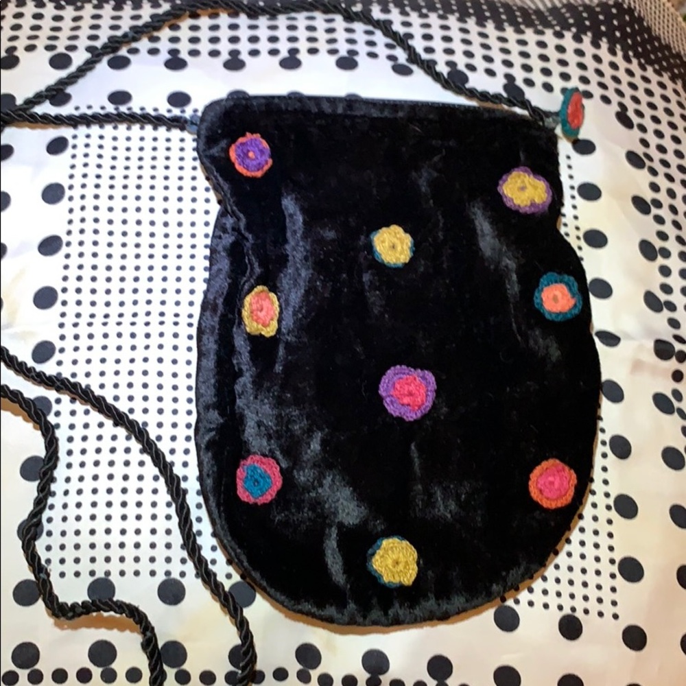 Velvet pouch with macramé flowers made in India